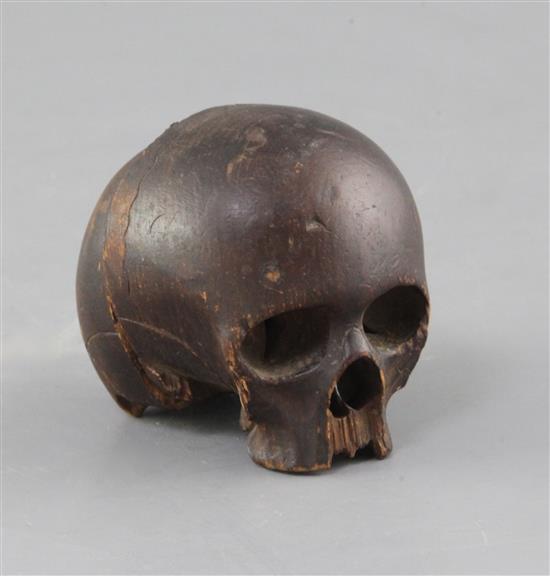 An antique European carved softwood model of a skull, 3in.